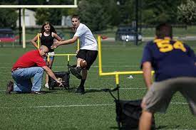 Picture of people playing  with 'Backyard Football Game Chair'